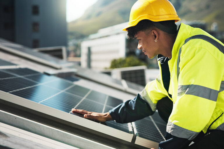 solar-panels-cell-and-install-with-man-in-city-for-HNDRMK4.jpg